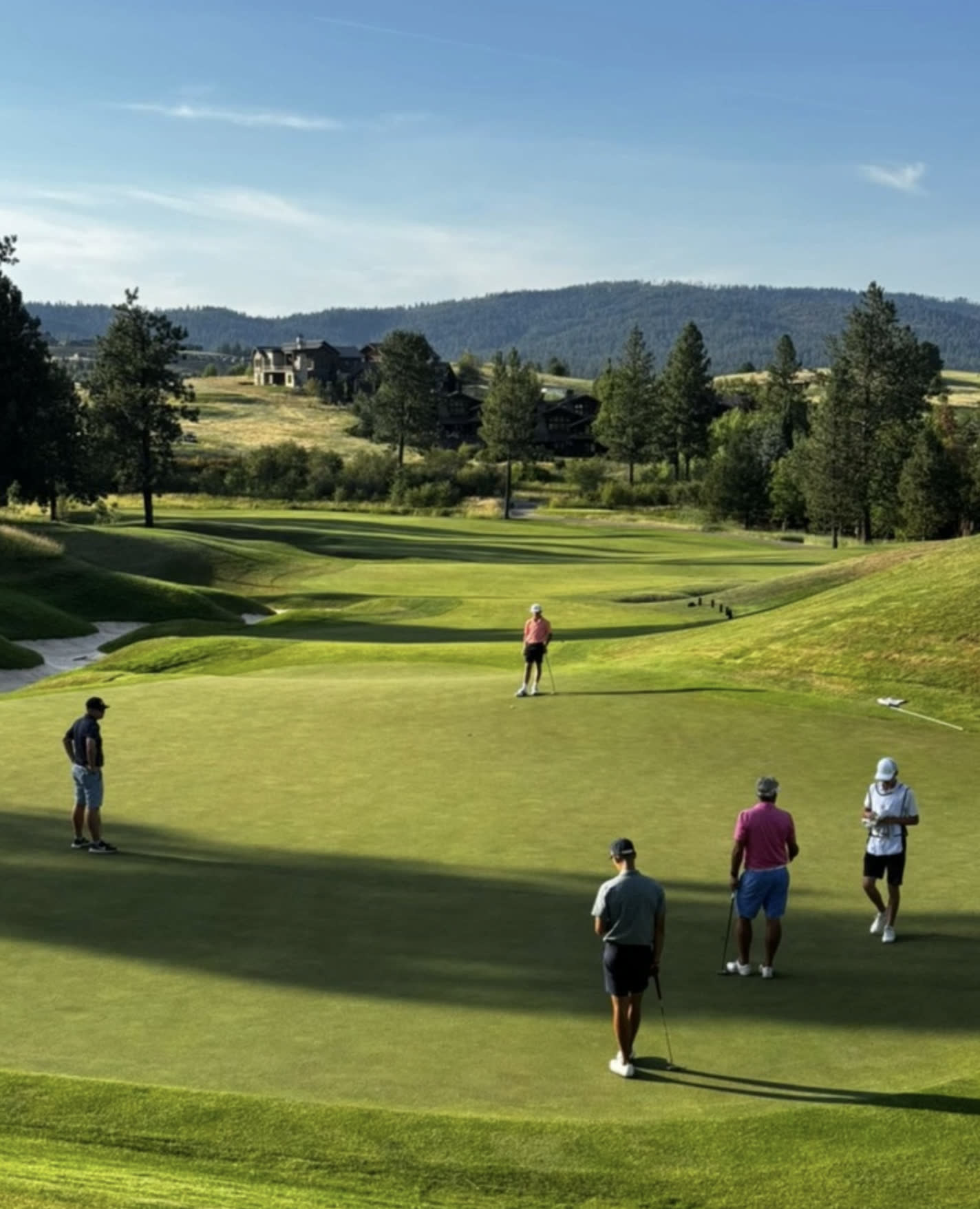 Golfers walking a fairway